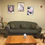 couch in the waiting area of {PRACTICE_NAME}
