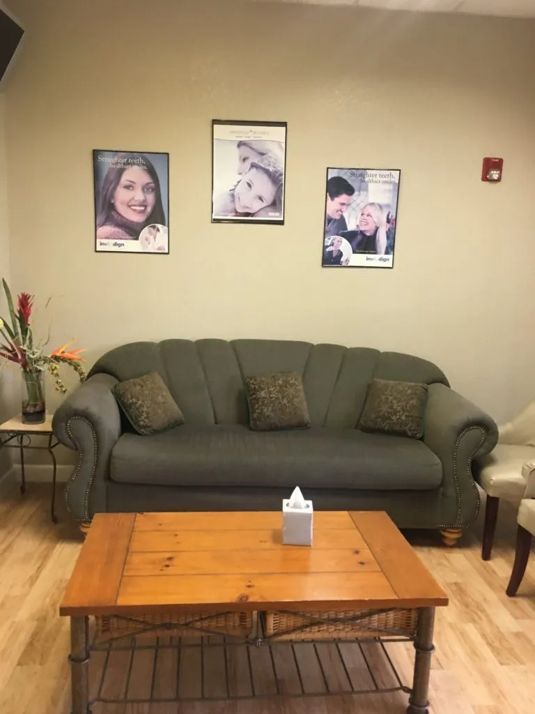 couch in the waiting area of {PRACTICE_NAME}